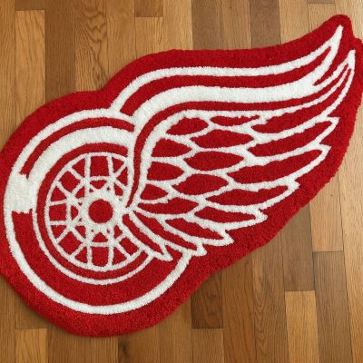 Tufted Rug “Winged Wheel” (contour cut, handmade)